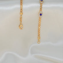 Gold plated bracelet with multiple sapphire blue evil eye charms