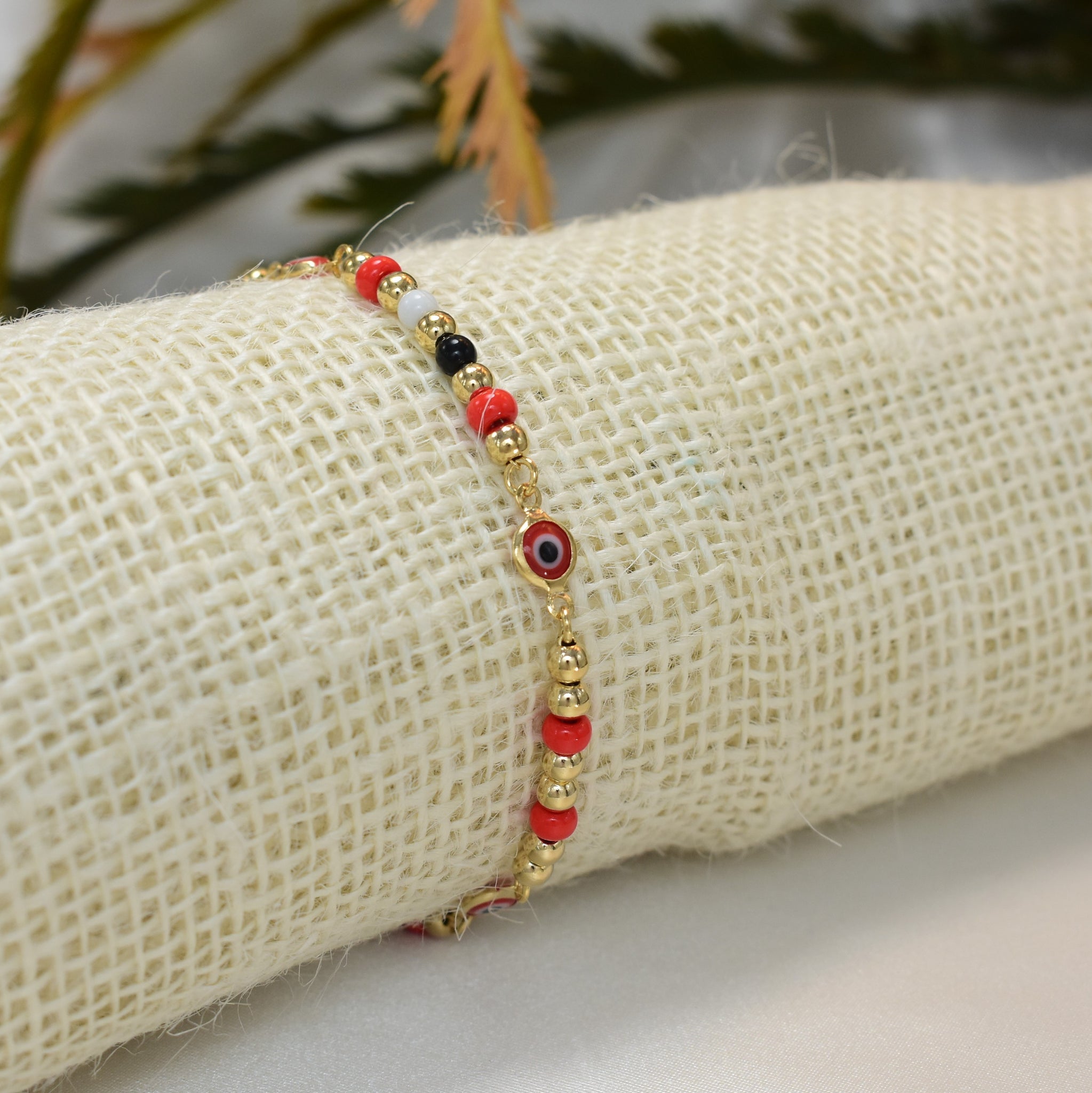 14k gold plated bracelet featuring evil eye beads, designed as a protection pulsera.
